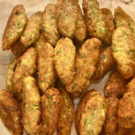 A dish with many Zucchini Parmesan Croquettes