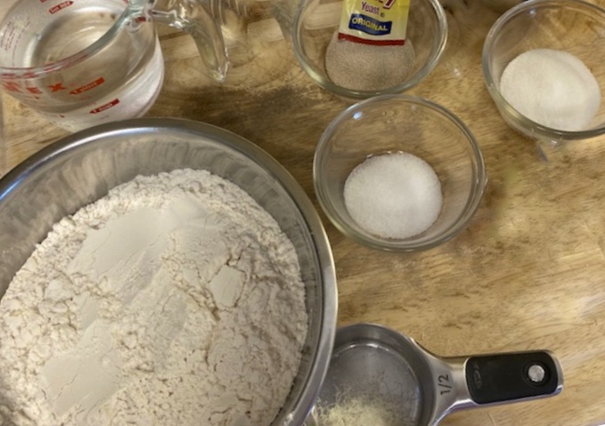 Ingredients flour, water, yeast, sugar and salt to make French baguette 